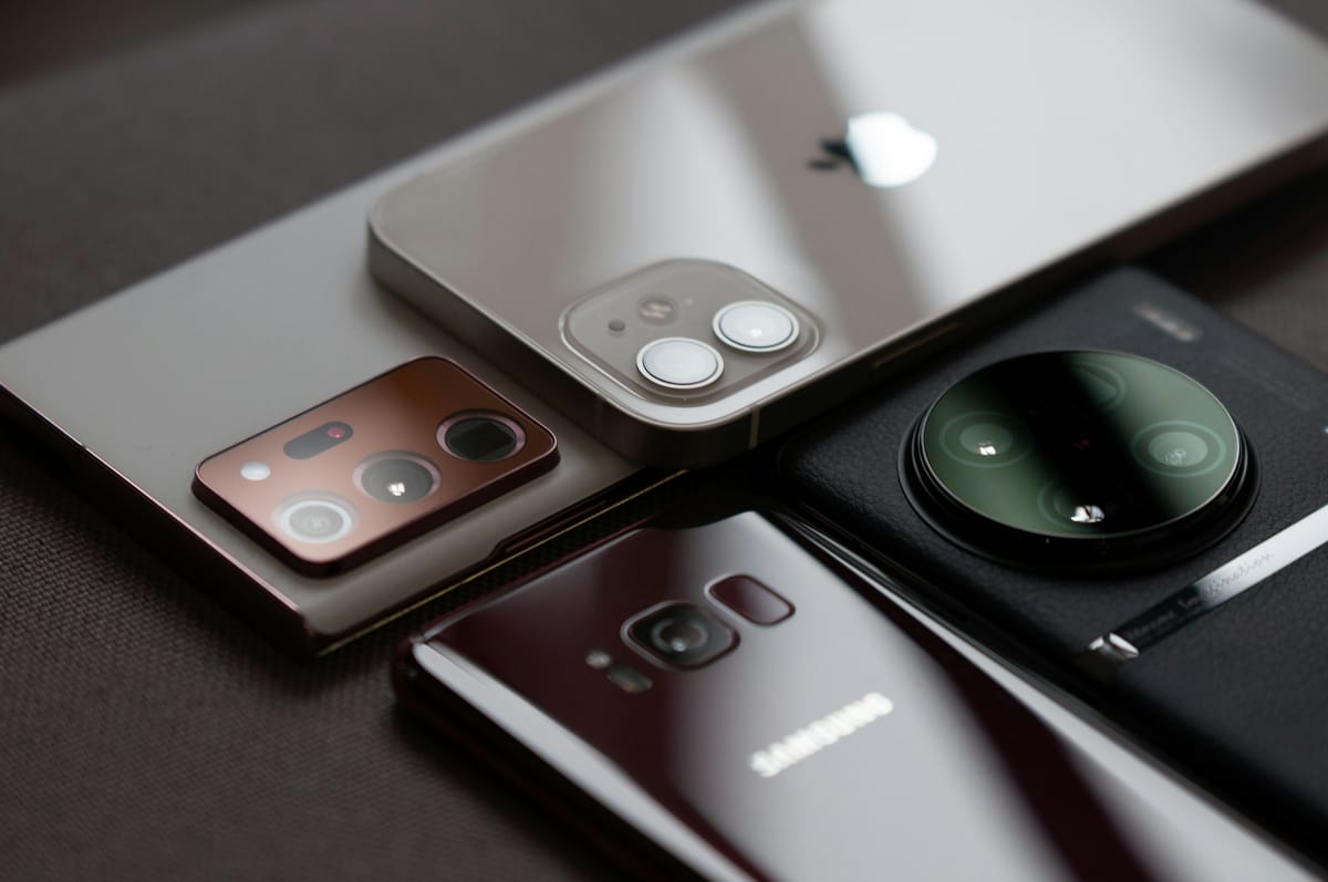 Several smartphones from different brands lying together on a table