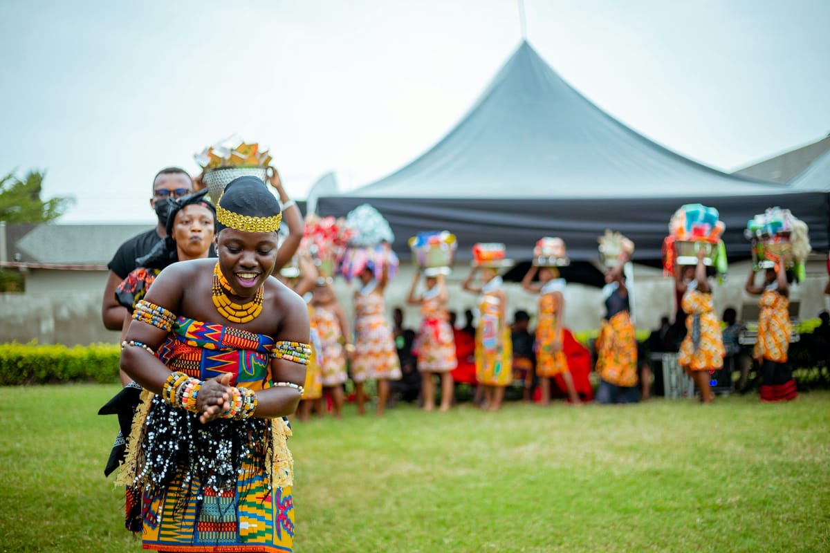 People in traditional Ghanaian dress at a celebration