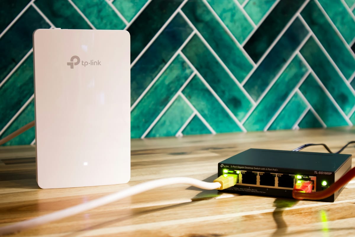 A router and a network switch with cables connected