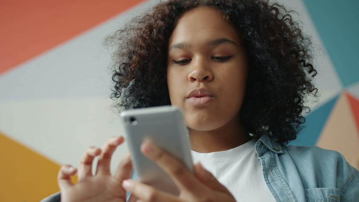 A young woman scrolling on her smartphone