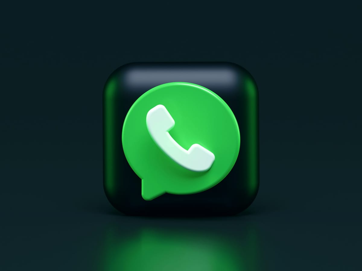 A green WhatsApp-style icon on a dark background