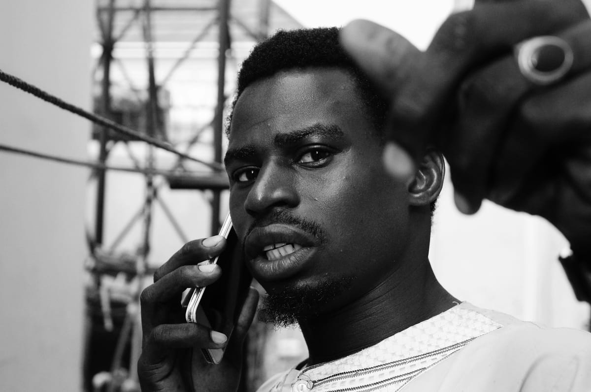 A man on a phone call, looking concerned