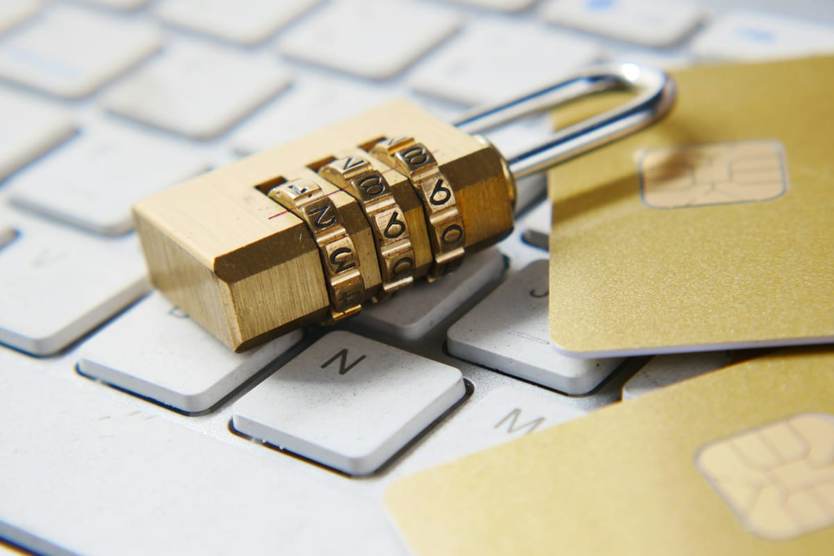 A golden padlock on a laptop keyboard