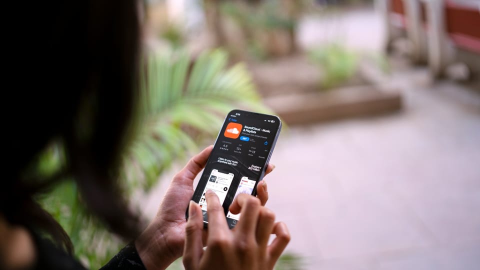 A woman holding a smartphone