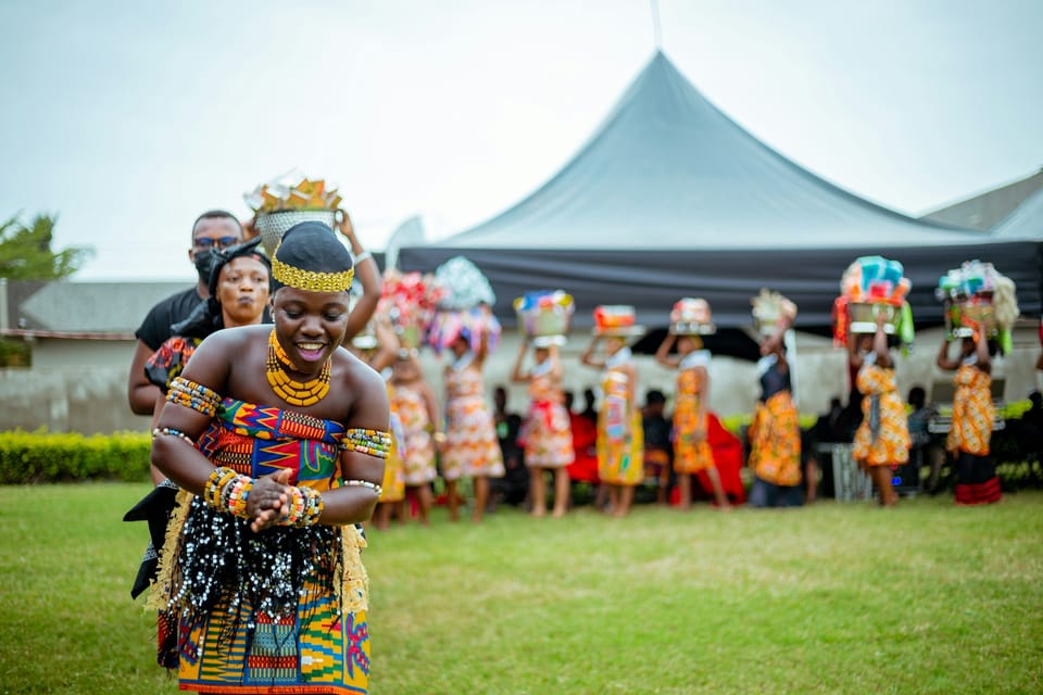 People in traditional Ghanaian dress at a celebration