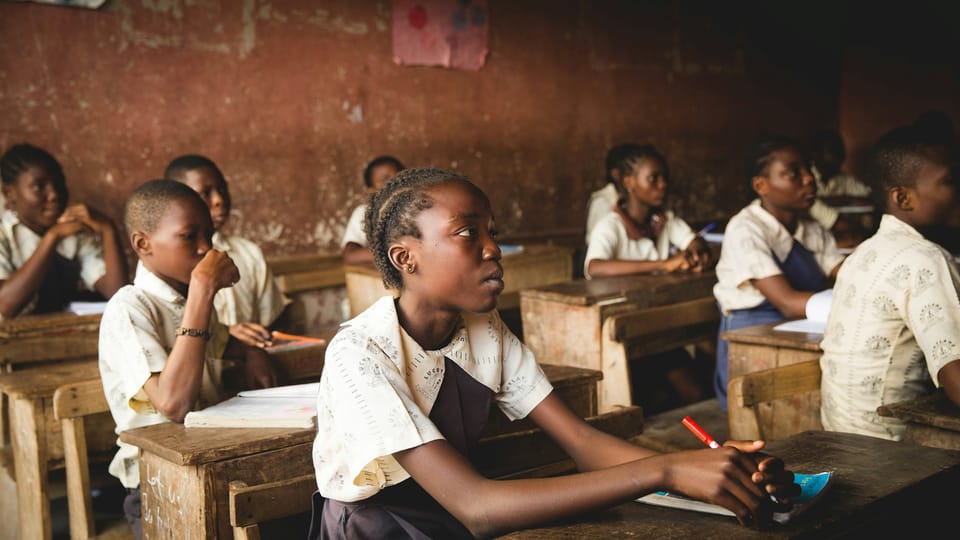 Students sitting at desks in a classroom