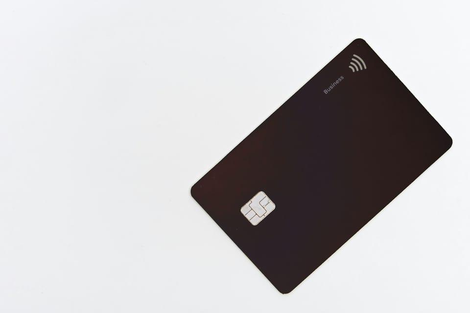 A black bank card with a chip