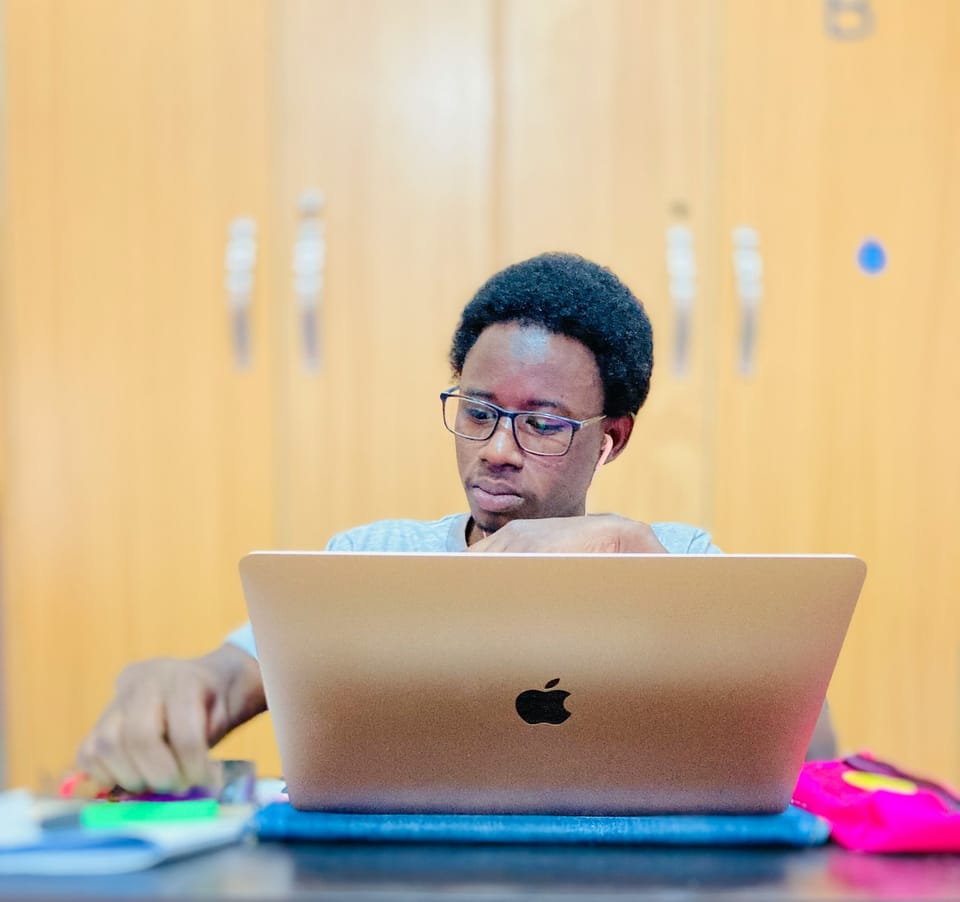 A man working on a laptop at a table